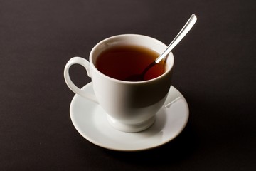 Cup of Tea with Spoon on Table