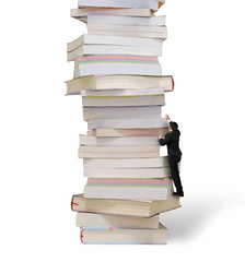 Reading and learning a mountain of new knowledge concept. Business man climbing on high stack of books, isolated on white background.