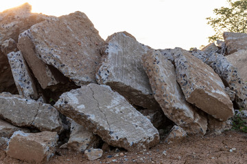 Large concrete debris and early morning light.