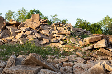 View of concrete debris piles with sunlight.