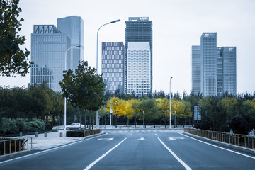 Naklejka premium city road through modern buildings in Tianjin