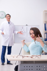Young woman visiting male doctor oculist