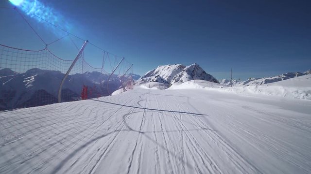 First Person View POV: Skier Skiing With Amazing Mountain Scenery In Swiss Alps On Perfect Slopes. Stabilized Shot Of Skiing During Sunny Day Switzerland