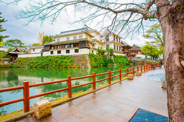Kokura-jo Castle, Japanese Castle in Katsuyama Park, full of red leaves in autumn leaves at Kitakyushu, Fukuoka Prefecture, Japan, near the Riverwalk Department Store