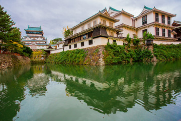 Fototapeta premium Kokura-jo Castle, Japanese Castle in Katsuyama Public Park,Filled with red leaves In the fall leaves.at Kitakyushu, Fukuoka Prefecture, Japan.Onsen atmosphere.