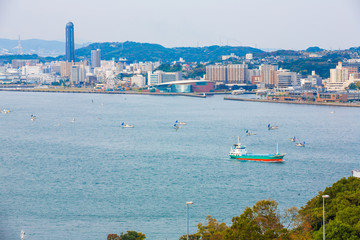 Kitakyushu, Japan - November 20, 2016 :Views of the island of Honshu, Osaka, Japan, a large port city and a commercial center, viewed from Kanmon strait and Kanmonkyo Bridge.