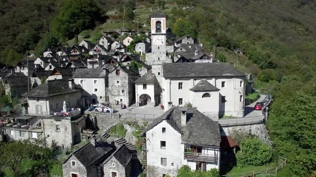 aerial view of church steeple in medieval town village of Corippo in the swiss mountains, small old mountain village in Ticino, Switzerland