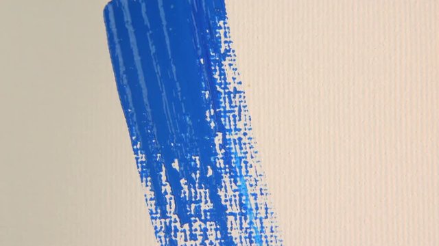 Blue colour brush stroke on white canvas close-up #3