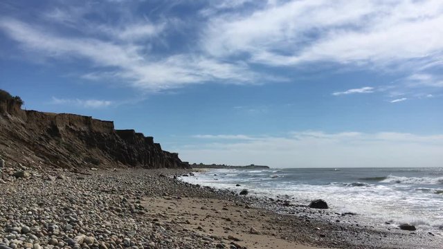 Waves rolling in on the rocky shore of the beach at Montauk, Long Island, NY.