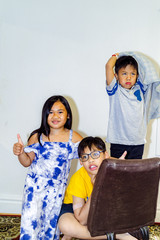 happy littles asian  kids  in studio, fashion kids portrait white bacground.