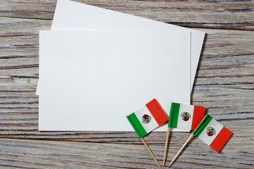 September 16. Independence day Mexico, the concept of independence , patriotism and freedom. Mini paper flags on wooden background. horizontal