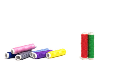 Color sewing threads isolated on white background.