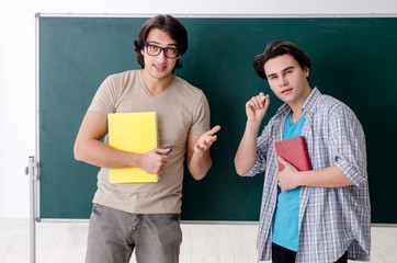 Two male students in the classroom