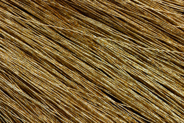 Obraz premium Closeup yellow tassel on table. Concept of fashion article background.