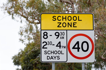 Australian speed road sign in school zone with 40km and times for school days, Victoria Australia 