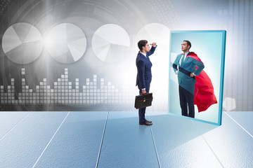 Businessman seeing himself in mirror as superhero