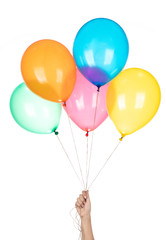Hand holds colorful balloons isolated on a white background. © cloud7days