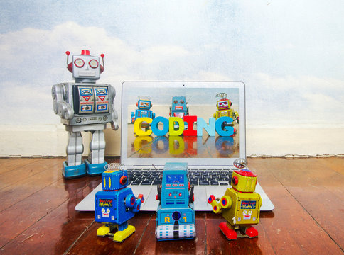 robot kids learn code from a laptop