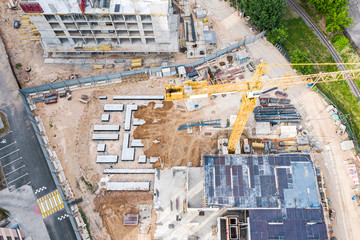 aerial top view of construction site. industrial machinery building new apartment buildings