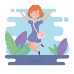 happy young woman celebrating jumping in the field