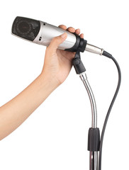 hand holding condenser microphone microphone on stand isolated on white background