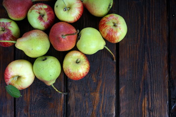 apples and pears on a dark background
