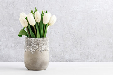 Pink tulips in silver bucket.