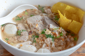 Tom Yum noodle, a spicy noodle with pork and pork balls in Thailand