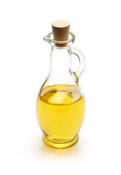 Olive oil in a glass bottle isolated on white background