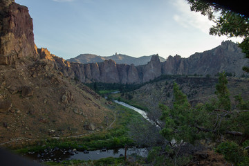 River flowing through Smith Rock National Park as the sun rises in Oregon USA July 2019