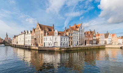 Fototapeta na wymiar Medieval buildings along a Spiegelrei canal in Bruges, Belgium