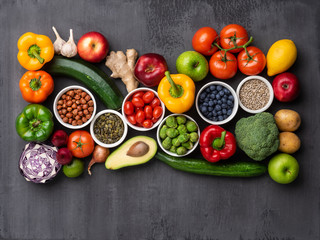 Healthy eating ingredients: fresh vegetables, fruits and superfood. Nutrition, diet, vegan food concept