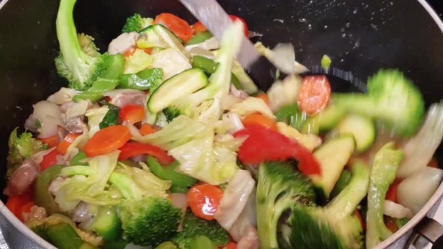 Cooking and mixing filipino vegetable chopsuey