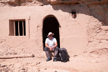 backpacker traveler with hat and white shirt