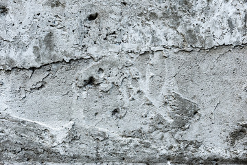 Obraz premium Texture of a concrete wall with cracks and scratches which can be used as a background