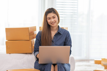 SME entrepreneur of Young Asian women working with laptop for Online shopping at home,Cheerful and Happy with box for packaging in home,Own Business Start up for Business Online and Online shopping