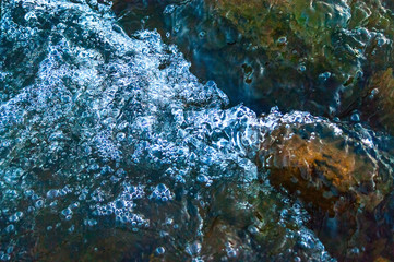 Whitewater, Splashes of River Flowing Over Rocks at High Current.