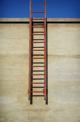 Rusted industrial roof access ladder