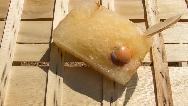 frozen egg eye with the most of hens and the shell that melts slowly seen in time lapse