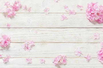 Rolgordijnen pink hydrangea on white wooden background © Maya Kruchancova
