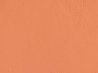 Textured plaster in coral . Background or texture seamless pattern