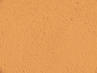 Textured plaster in terracotta . Background or texture seamless pattern