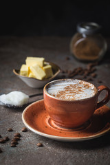 Bulletproof coffee, blended with organic butter and MCT coconut oil, paleo, keto, ketogenic drink breakfast.
