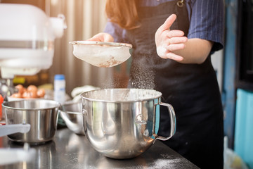 Beautiful woman is making bakery