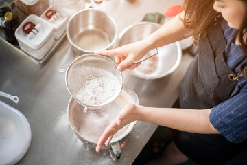 Beautiful woman is making bakery