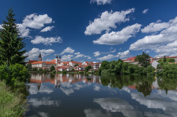 UNESCO protected Czech city Telc city scape on the castle with water reflection