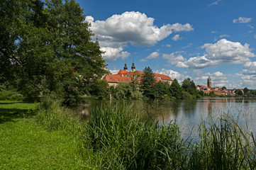 UNESCO protected Czech city Telc city scape on the castle with water reflection