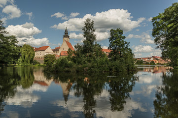 Obraz premium UNESCO protected Czech city Telc city scape on the castle with water reflection