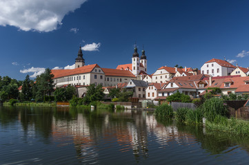 Naklejka na ściany i meble UNESCO protected Czech city Telc city scape on the castle with water reflection