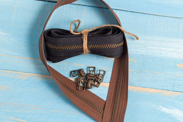 Black and brown metal brass zippers stripes with sliders for handmade leatherwork leathercraft on...
